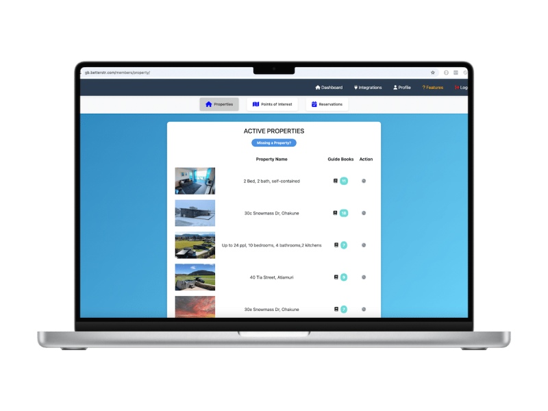 Laptop screen showing BetterSTR property management dashboard with property listings